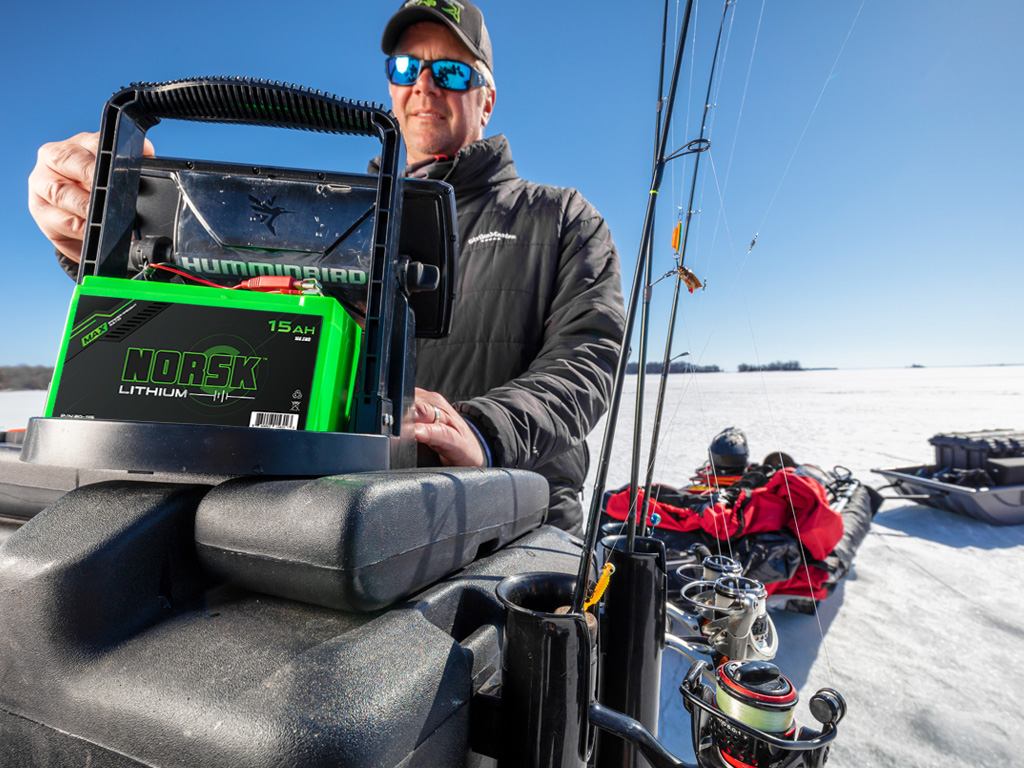 Ice Fisherman hooking up his Norsk Lithium Battery to power his Sonar