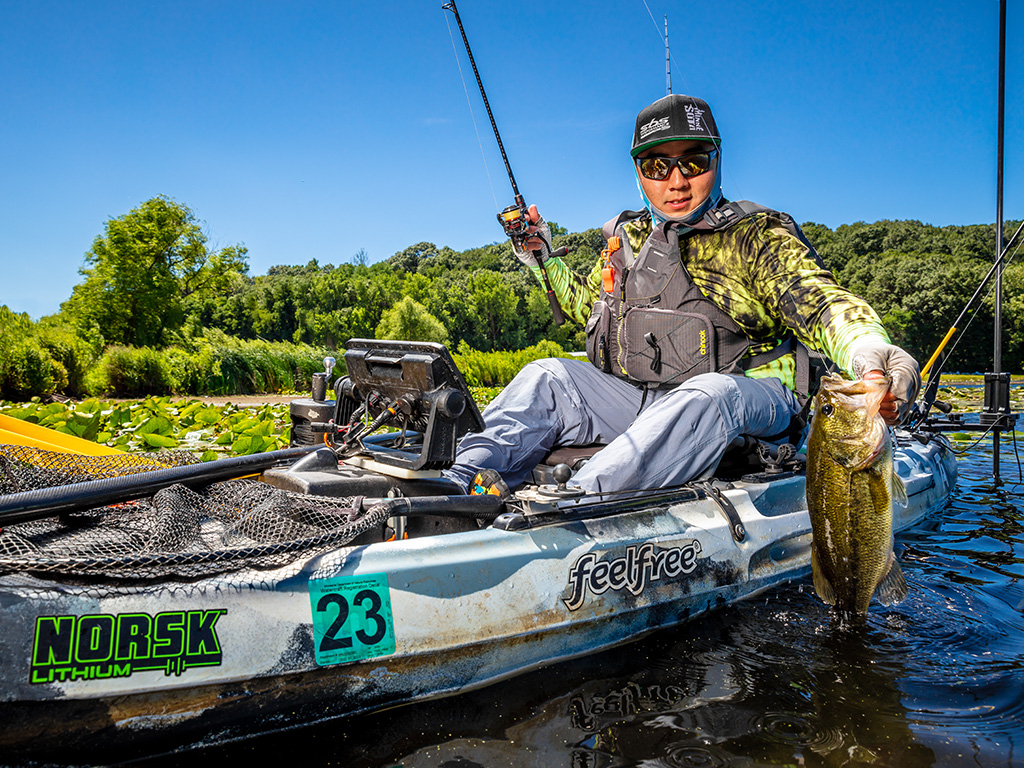 Kayak Angler Catching a Bass with electronics powered by a Norsk 20.8 Ah Lithium Battery
