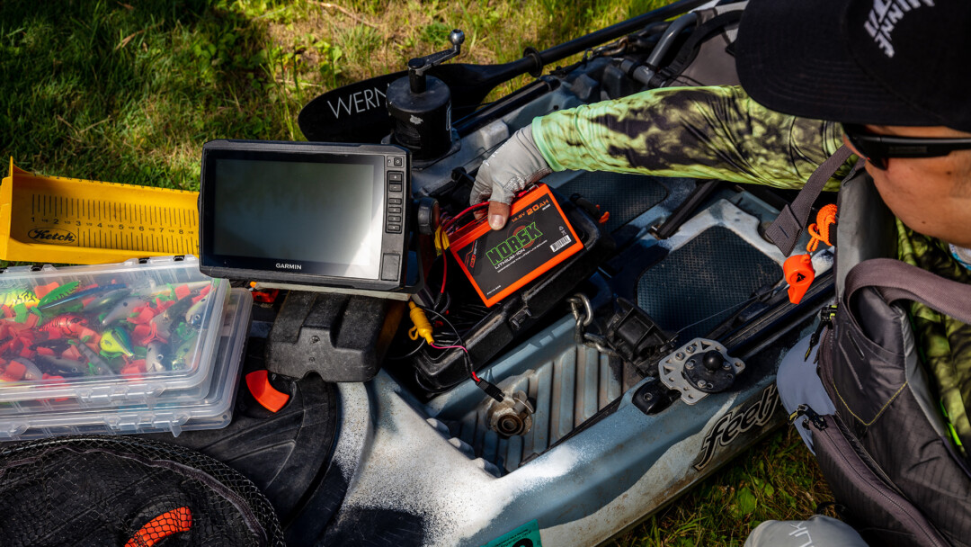 Norsk Lithium Kayak angler prepping to power his electronics with a Norsk 20Ah Lithium ion battery – 1920X1080 Norsk Lithium Kayak angler prepping to power his electronics with a Norsk 20Ah Lithium ion battery 1920X1080
