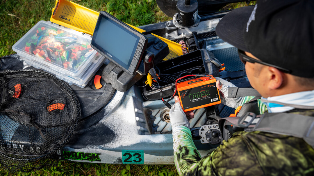 Norsk Lithium Kayak angler prepping to power his electronics with a Norsk 32Ah Lithium ion battery 1920X1080