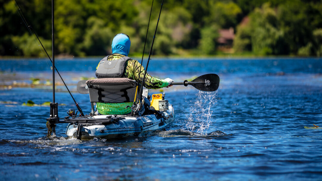 Norsk Lithium kayak angler paddling his kayak while powering his electronics with a a Norsk Lithium ion battery 1080X1920