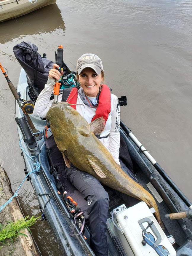 NORSK Lithium Kayak Pro Amy Hansen with Big Cat Fish