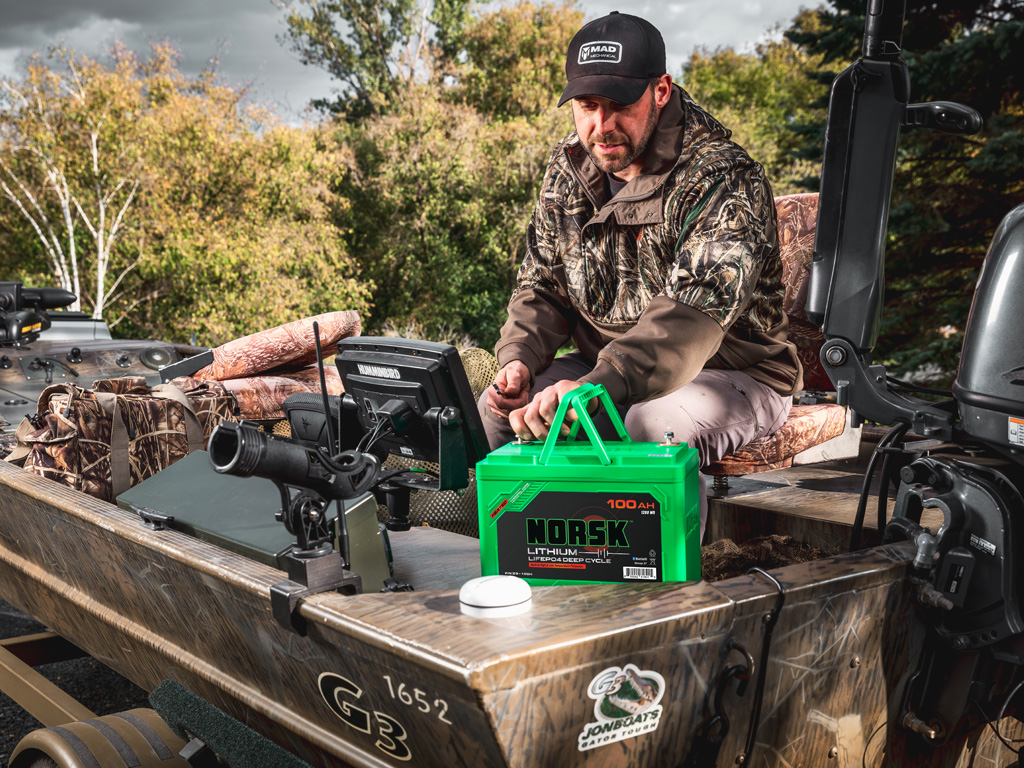 Duck Hunter using Norsk Lithium Heated Batteries in Jon Boat