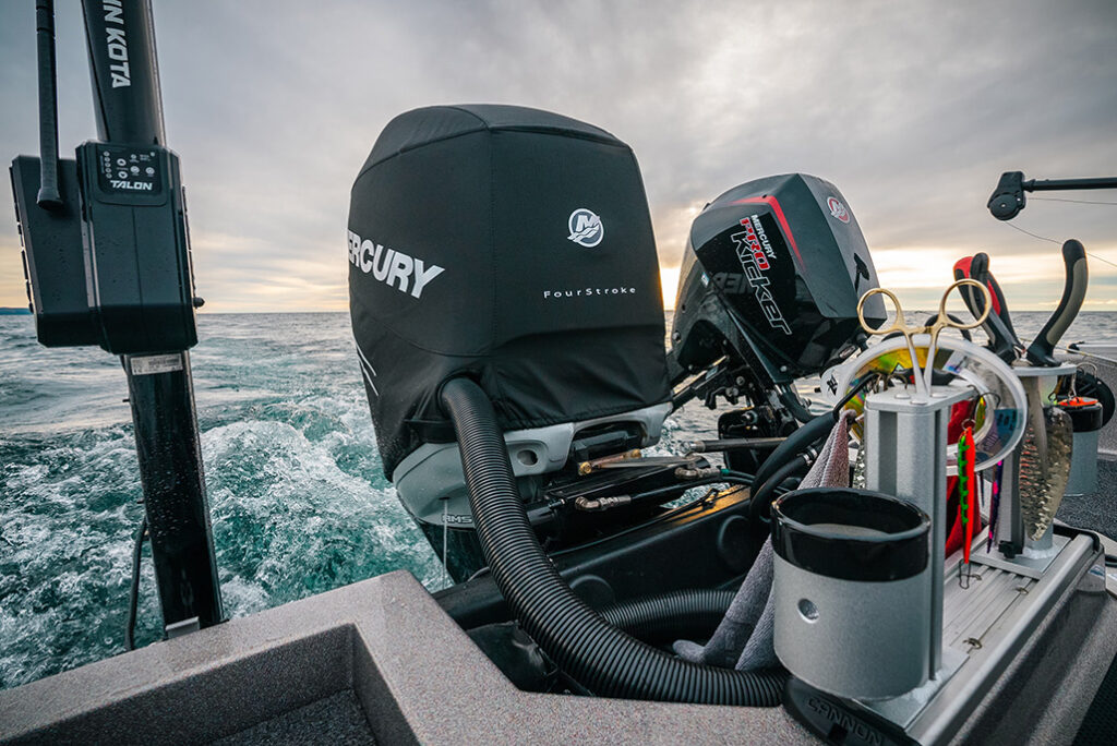 Close up photo of Mercury 400 Verado boat motor and kicker motor