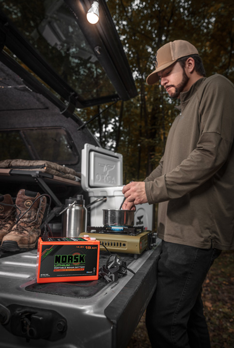 Norsk Lithium Batteries powering LED lghts while a truck camper cooks on a hunting trip2