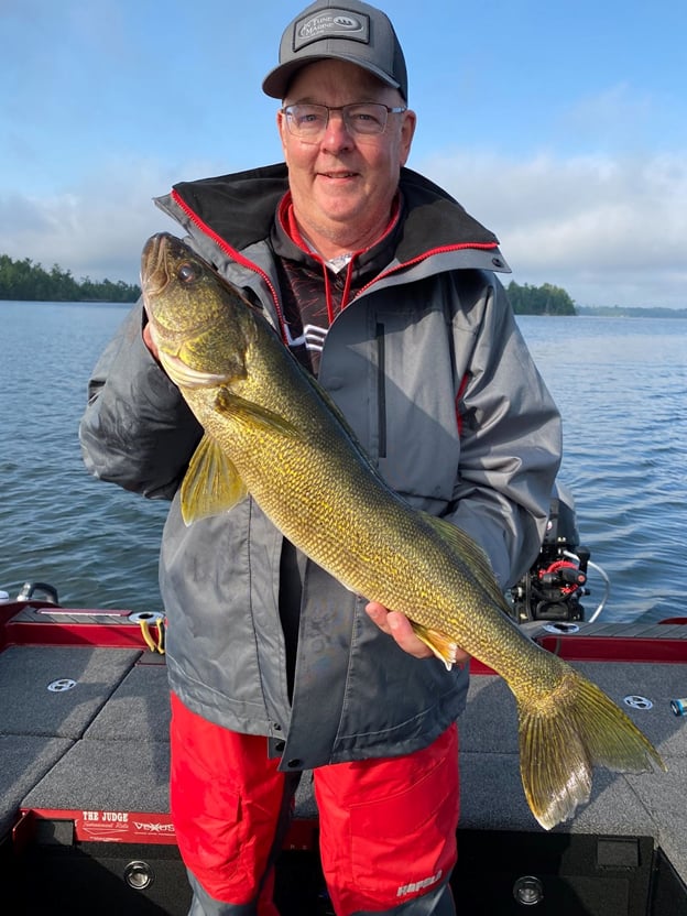 Norsk Pro Staff Team Member Tim Winterhalter holding walleye while fishing
