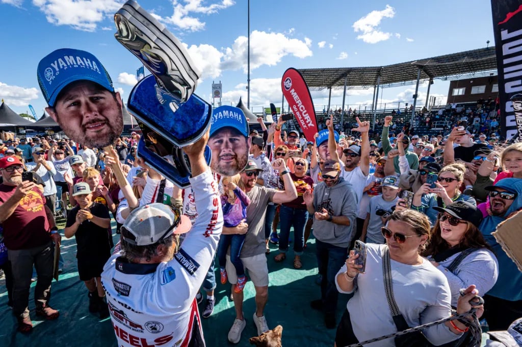 Pat Schlapper Norsk Pro Staff and Bassmaster Elite Champion Holding Trophy From Mississippi River Win at Lacrosse Wisconsin B.A.S.S. Photo