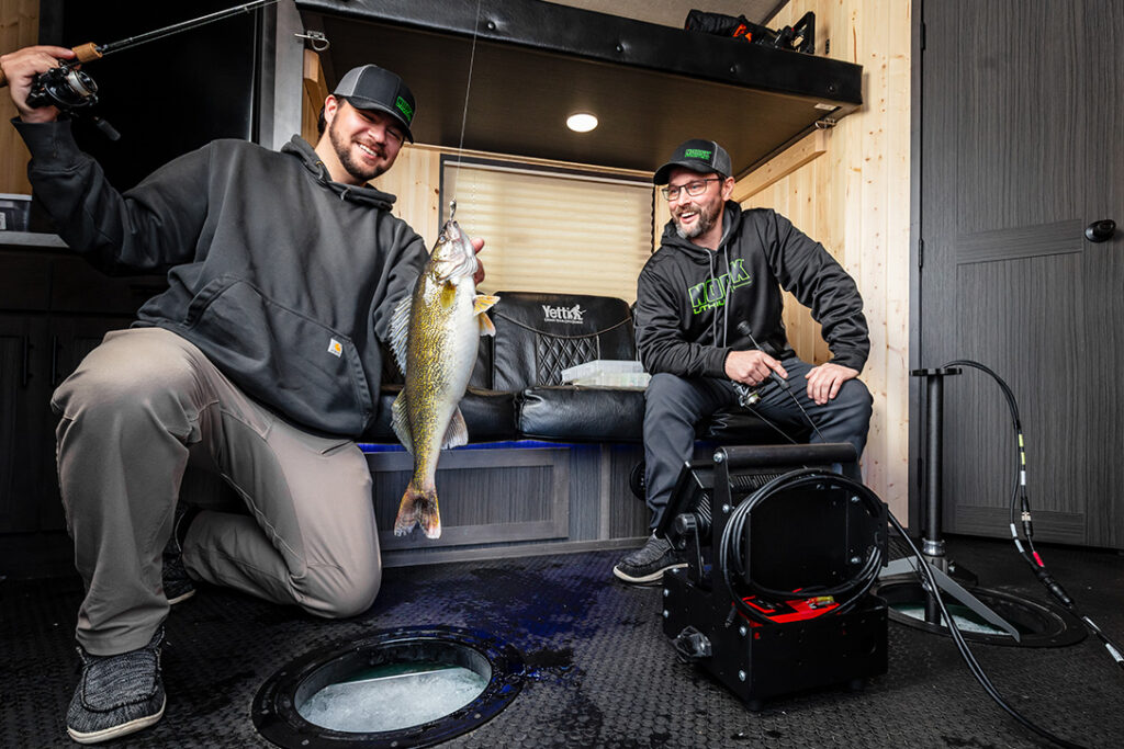 Angler Catching a Fish in a Yetti Wheelhouse Powered by Norsk Power 1086X724