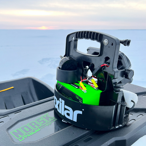 Vexilar with 15AH green portable sonar battery on rod box at sunset 500 x 500