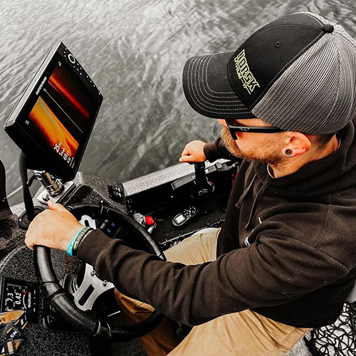 Luke Frome Driving The Boat With Nortsk Hat 500 x 500