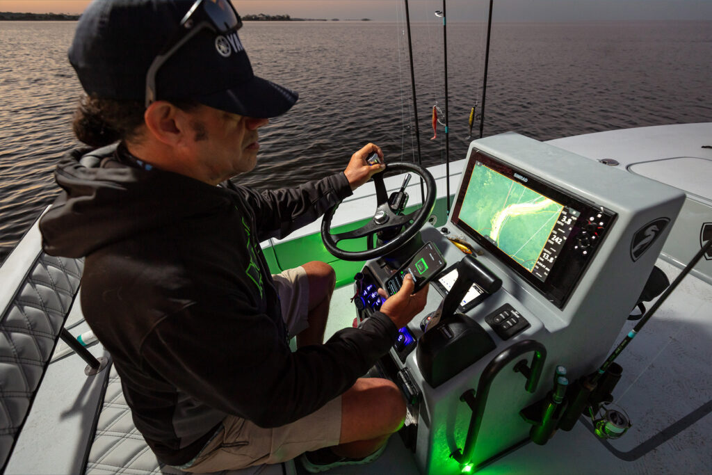 Chris Cenci Checking the Norsk Guardian App heading out in the morning in his Egret boat