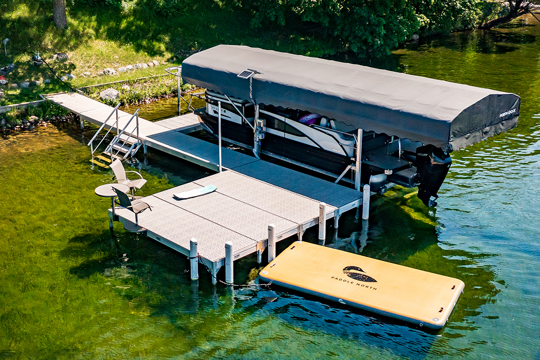 Norsk Lithium Boat Lift Battery being charged by a solar panel 1086X724