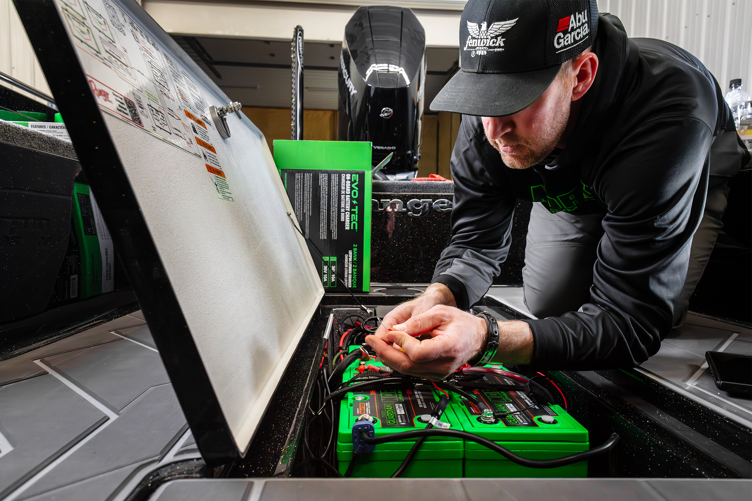 John Hoyer installing Norsk Lithium marine batteries into his boat